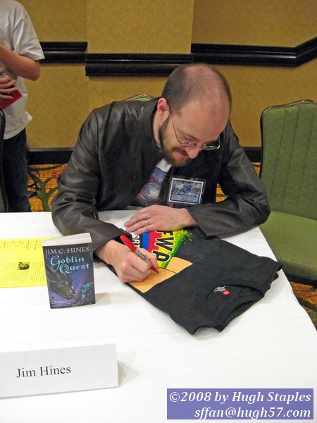 Jim C. Hines, coiner of the phrase "Farting Rainbows" signs SFWA t-shirt