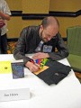 Jim C. Hines, coiner of the phrase "Farting Rainbows" signs SFWA t-shirt