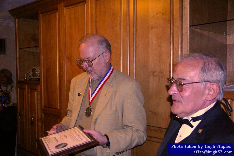 RAH Award winner is presented his award medal and plaque<br />by David Silver, President of the Heinlein Society